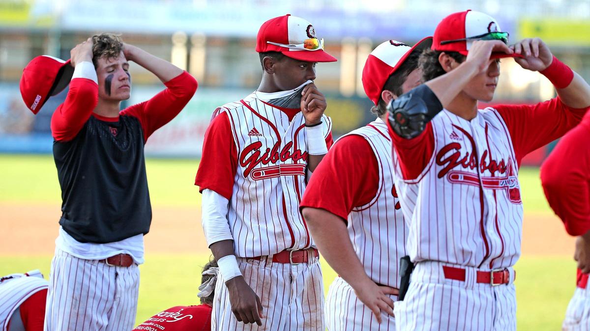 Cardinal Gibbons HS players after they were defeated by Melbourne Central Catholic HS in the FHSAA Class 5A Finals at CenturyLink Sports Complex - Hammond Stadium in Fort Myers, Florida, Thursday, May, 30, 2019.