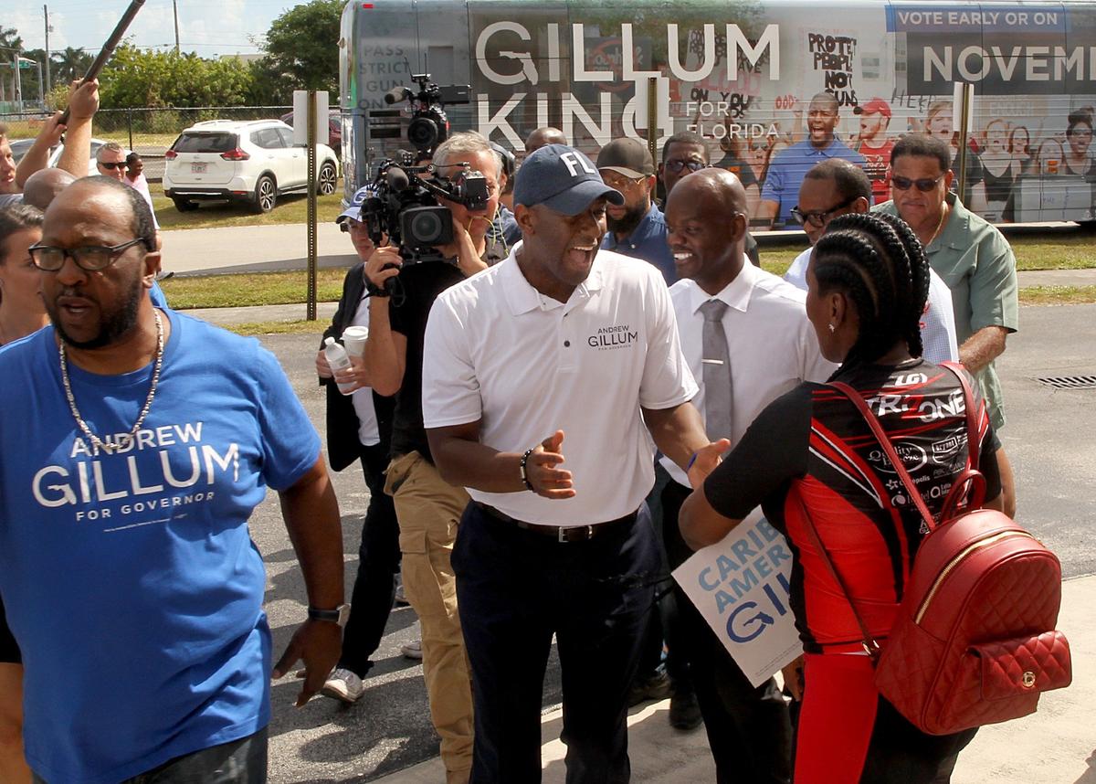 Andrew Gillum, Democratic nominee for Florida governor, greets supporters as he arrives at Bethel Church in his hometown of Richmond Heights to encourage early voting on Thursday.