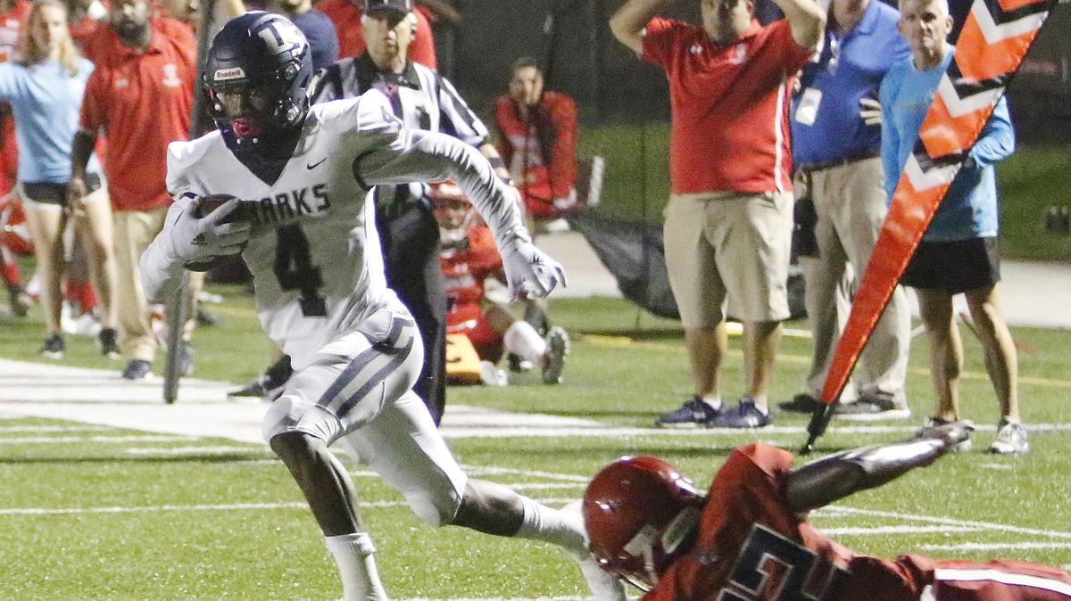 University School Sharks’ Xavien Flowers (4) runs for a touchdown against the Champagnat Catholic Lions during the football game on Thursday, October 11, 2018 at NSU University School in Davie