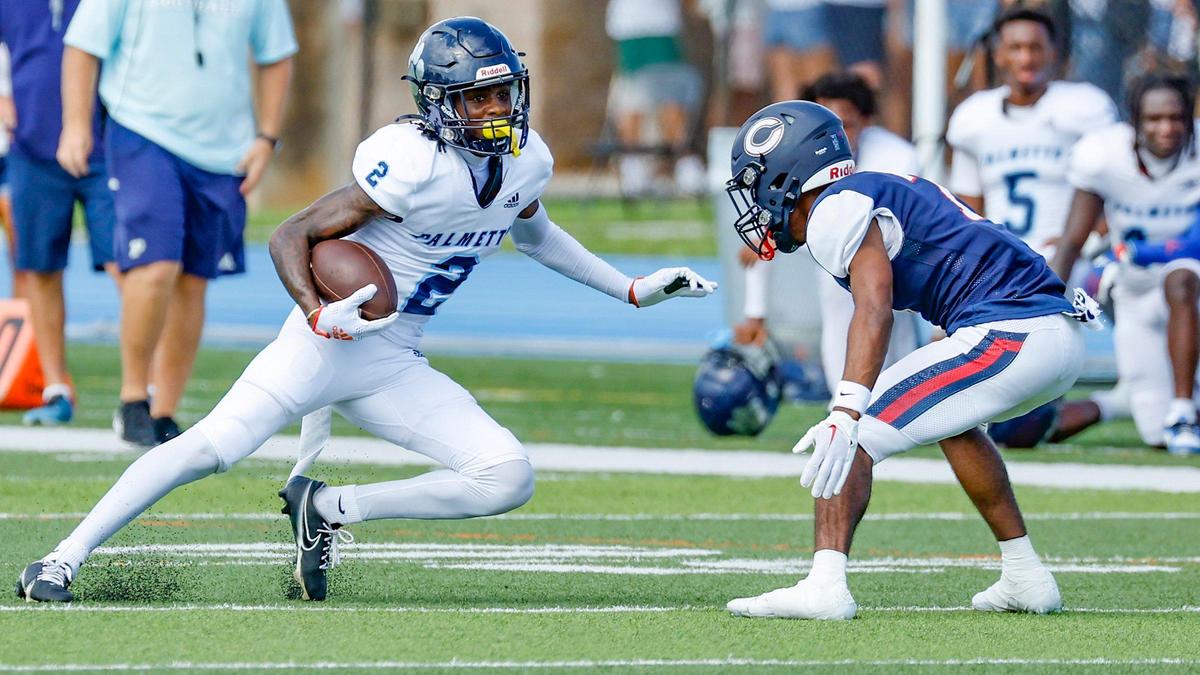 Palmetto High School wide receiver Jacory Barney runs for yardage as Columbus High School cornerback Jancent Wallace (7) attempts to make the stop at Tropical Park Stadium in Miami, Florida on Saturday, September 16, 2023.