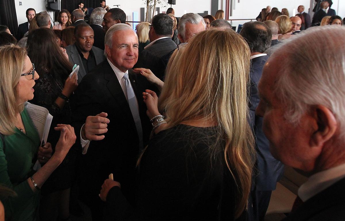 Miami-Dade County Mayor Carlos Gimenez is greeted by members of the audience after giving his State of the County address on Thursday, Jan. 31, 2019, at PortMiami.
