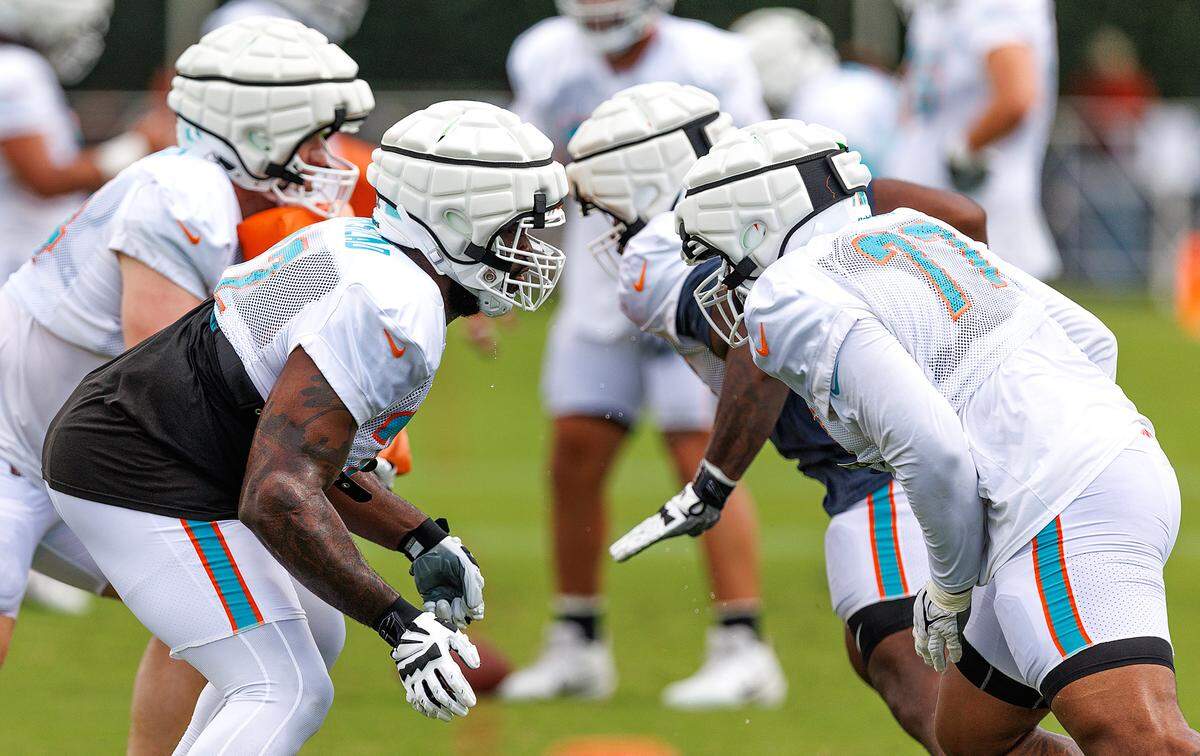 Miami Dolphins offensive tackles Terron Armstead (72) and Isaiah Wynn (77) participate in a drill during NFL football training camp at Baptist Health Training Complex in Hard Rock Stadium on Tuesday, August 1, 2023 in Miami Gardens, Florida.