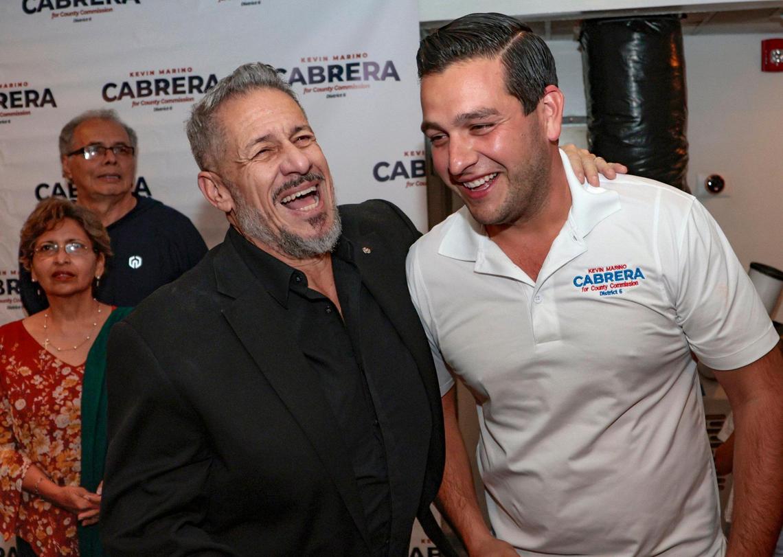 At his victory party, Miami-Dade County Commission candidate Kevin Marino Cabrera, right, celebrates with Commission Chairman Jose “Pepe” Diaz at Beat Culture Brewery in Miami on Tuesday, Nov. 8, 2022. Cabrera won the District 6 seat to replace term-limited Rebeca Sosa.