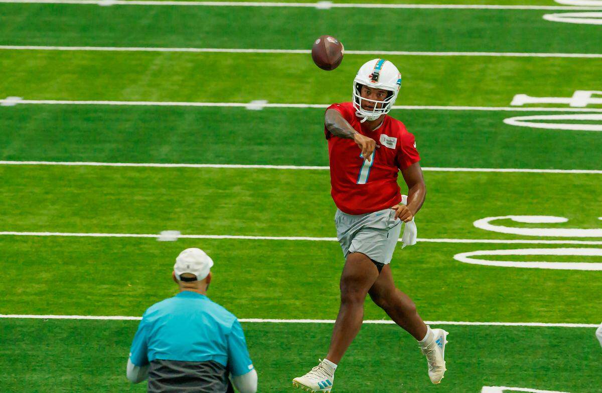 Miami Dolphins quarterback Tua Tagovailoa (1) throws a pass during NFL football training camp at Baptist Health Training Complex in Hard Rock Stadium on Tuesday, August 22, 2023 in Miami Gardens, Florida.