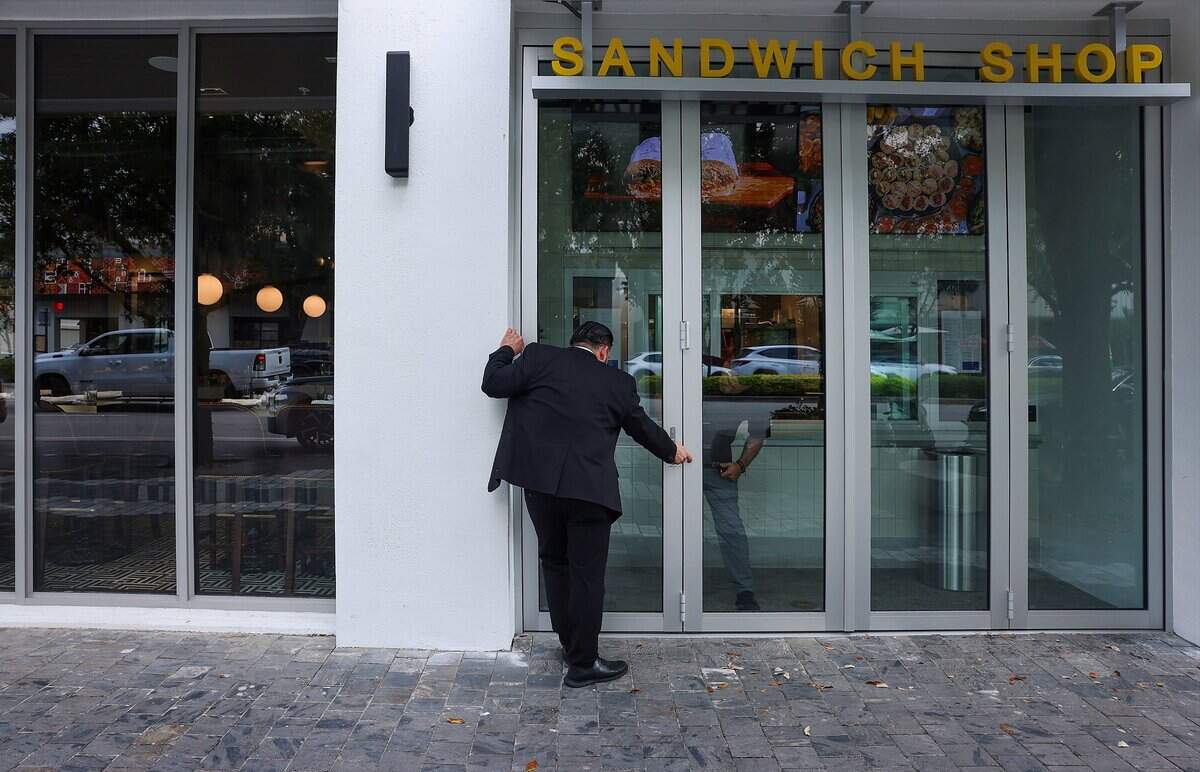 Buccan staffers prepares the windows and doors as they prepare for “friends and family” opening at the new restaurant in Coral Gables, ahead of its official opening on Tuesday, May 19, 2026.