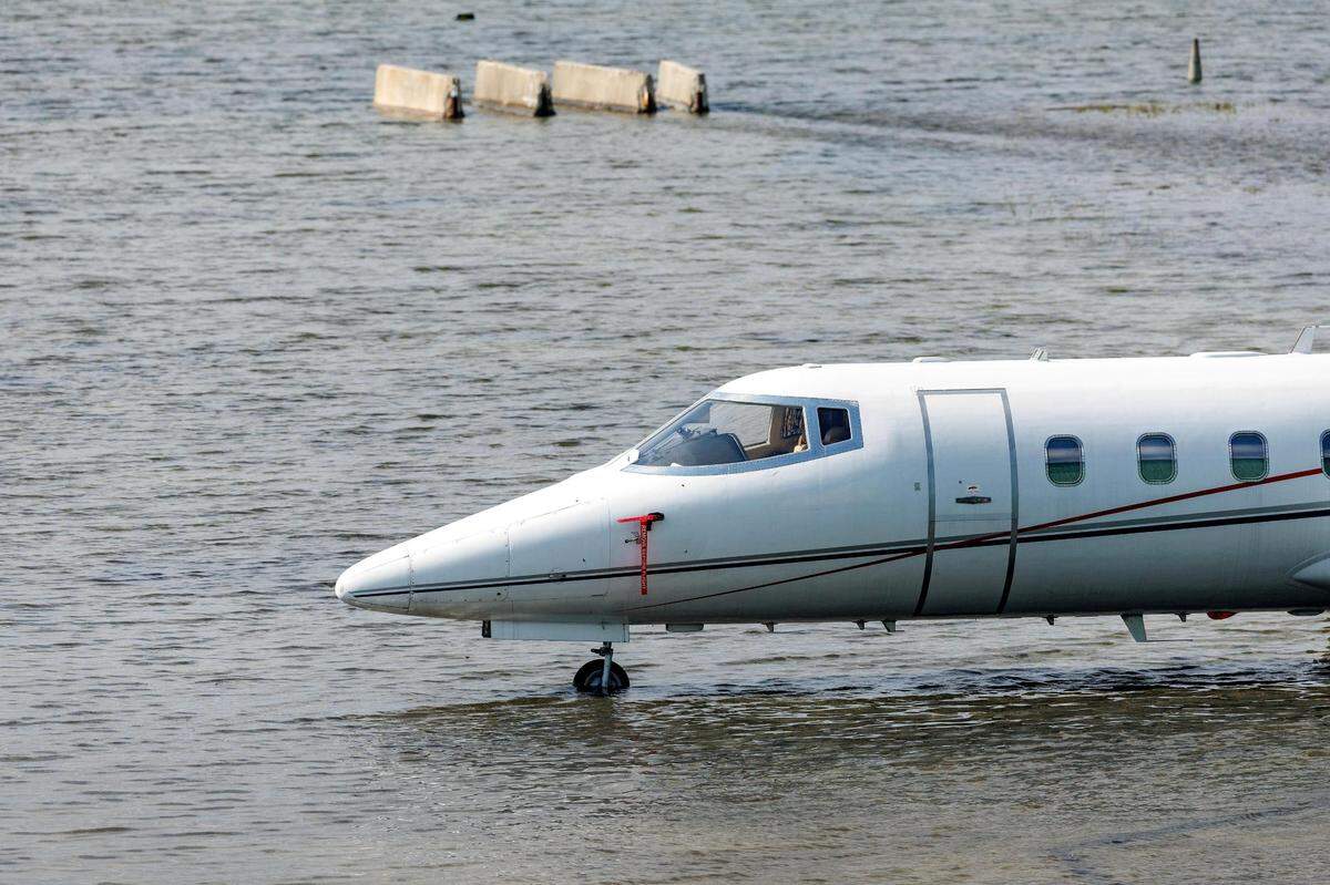 A private jet charter next to the hangar as the runway remains flooded from heavy rain at Fort Lauderdale-Hollywood International Airport on Thursday, April 13, 2023.