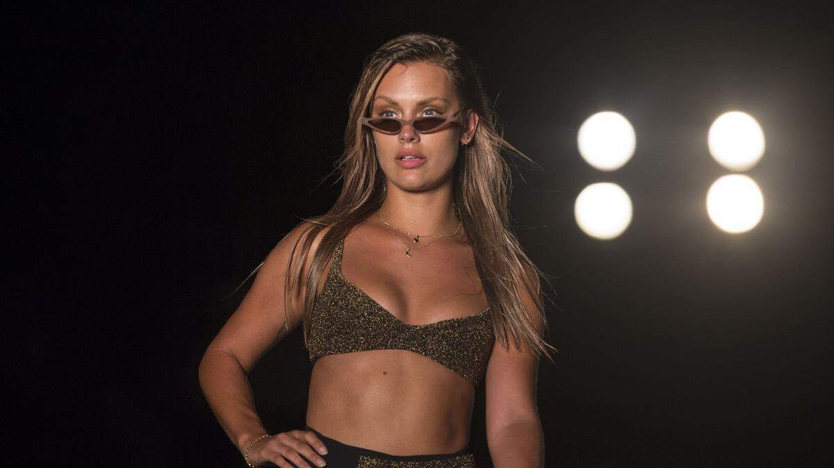 A model walks the runway for the 2018 Sports Illustrated Swimsuit show at PARAISO during Miami Swim Week at The W Hotel South Beach in Miami Beach, FL, on July 15, 2018.