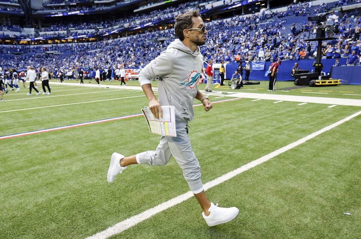 Miami Dolphins head coach Mike McDaniel runs off the field  after the Indianapolis Colts defeat the Dolphins 33-8 in an NFL game at Lucas Oil Stadium in Indianapolis on Sunday, September 7, 2025, in Indianapolis.