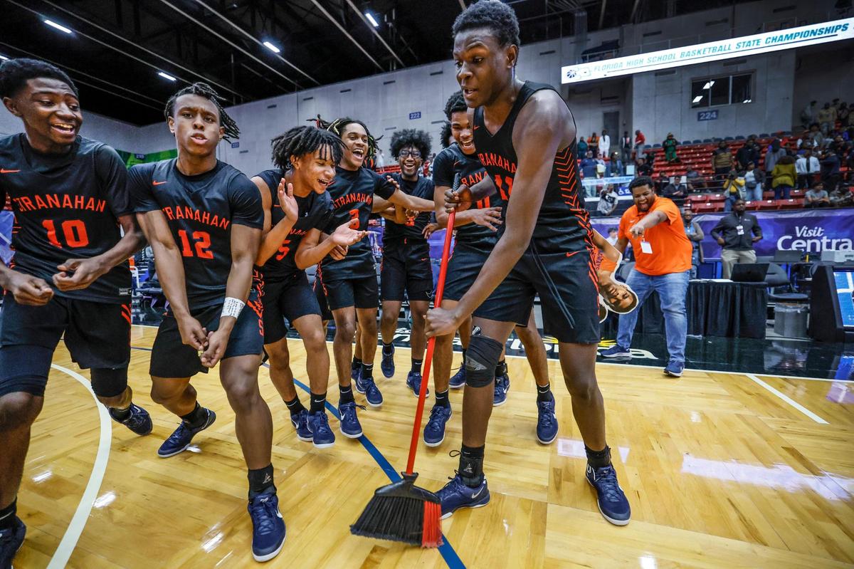 Stranahan High School’s Isaiah Brown (11) sweeps the court as the team celebrates the win over Gibbs High Schoo for the FHSAA Class 4A Boys High School Basketball State Championship.at the RP Funding Center in Lakeland, Florida on Thursday, March 6, 2025.