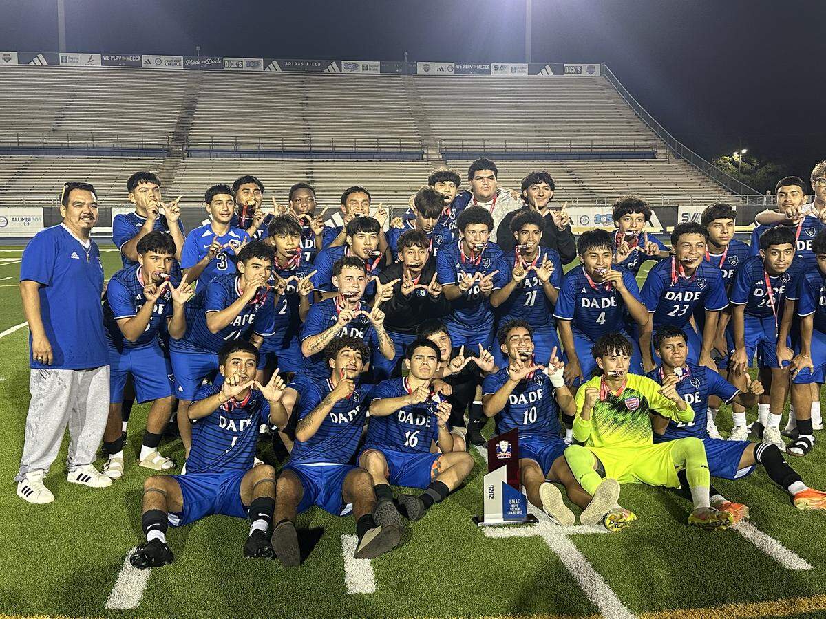 South Dade High’s boys’ soccer team gathers for a team photo at Traz Powell Stadium after defeating Reagan High for the GMAC championship.