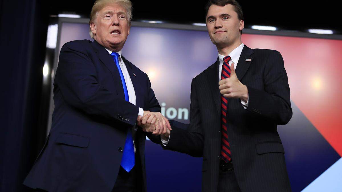 President Donald Trump shakes hands with moderator Charlie Kirk, during a Generation Next White House forum at the Eisenhower Executive Office Building on the White House complex in Washington, Thursday, March 22, 2018.