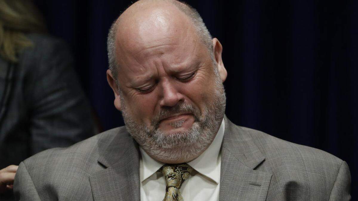 Former priest James Faluszczak, who says he was molested by a priest as a teenager, reacts as Pennsylvania Attorney General Josh Shapiro speaks during a news conference in Harrisburg, Pennsylvania, last week.