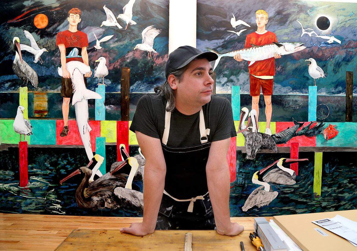 Artist Hernan Bas, stands by his pieces titled “A moment Eclipsed # one (left) and #two, in his studio in Miami. He is a Miami native who is the rare artist to make it big while still living in Miami, on Wednesday, September 25, 2019.