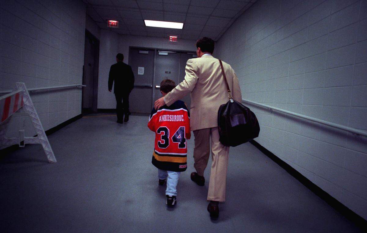 Panthers goalie John Vanbiesbrouck leaves the Miami Arena with his son, Ian, 7, after the Game 4 triple overtime loss to Colorado on June 10, 1996, that ended the 1996 Stanley Cup Final.