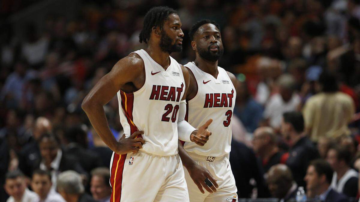 Miami Heat forward Justise Winslow (20) and Dwyane Wade (3) talk in the first quarter of an NBA basketball game against the Detroit Pistons at AmericanAirlines Arena on March 13. Those two will be at the epicenter of the Heat’s playoff push over the final days of the season.