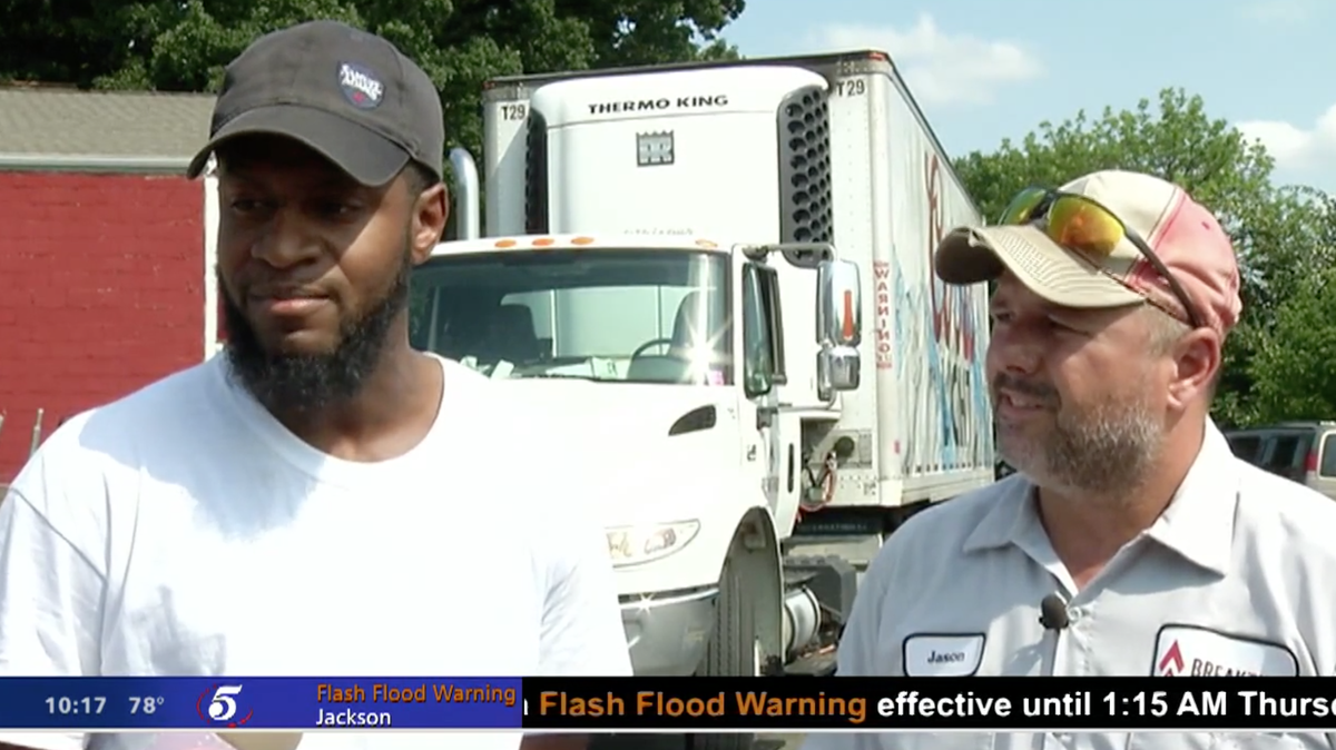 Kwame Anderson, left, and his co-worker Jason, right, were working as beer delivery men in St. Paul, Minnesota, when they saw a suicidal man on the bridge — and lured him to safety by offering him a 12-pack of Coors Light.