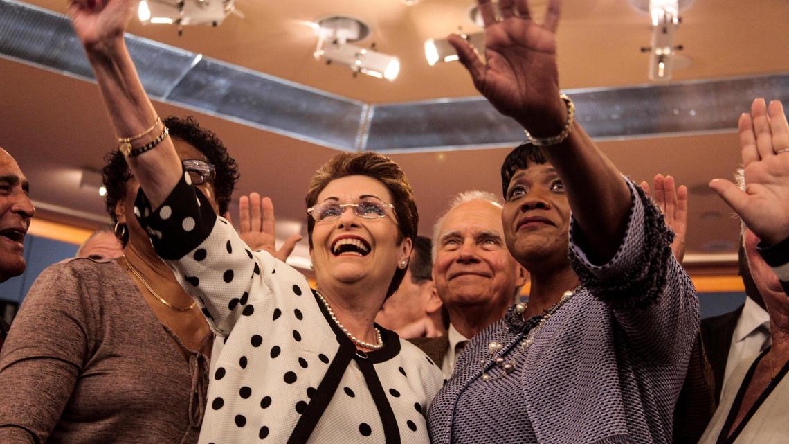 Audrey Edmonson, right, chairwoman of the Miami-Dade County Commission, stands with fellow commissioner Rebeca Sosa in January 2019. Term limits require Edmonson to leave office in 2020, part of an election cycle set to cause historic turnover on the 13-seat board. Sosa must leave office two years later, in 2022.