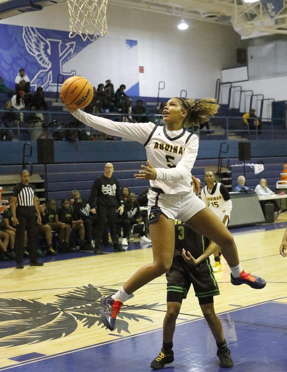 St. Thomas Aquinas Lady Raiders London Thomas (5) goes for a shot against Nova Lady Titans during the BCAA Big 8 girls basketball tournament final game on Saturday, January 31, 2026 at Fort Lauderdale HS in Fort Lauderdale. Andrew Uloza / for Miami Herald