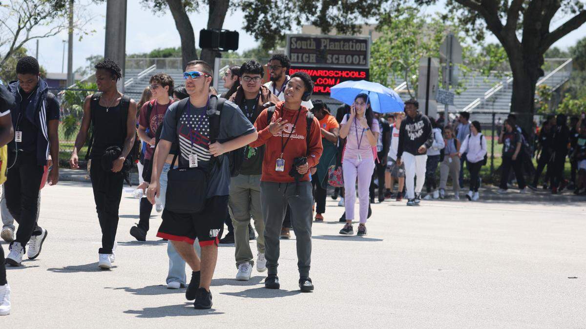 South Plantation High School students being evacuated to Heritage Park in Plantation after a bomb threat on Wednesday, September 6, 2023. (Carline Jean/South Florida Sun Sentinel)