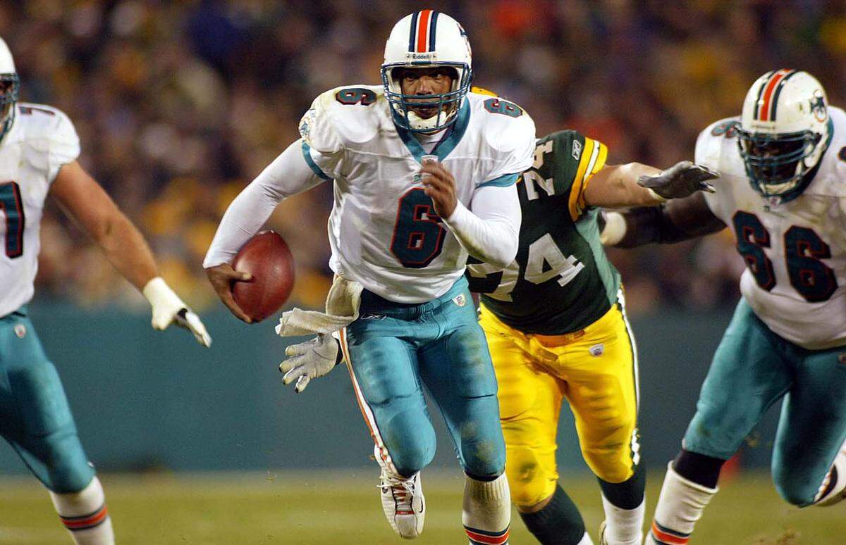 The Miami Dolphins visit the Green Bay Packers at Lambeau Field in Green Bay Wisconsin on Nov. 4, 2002. In third quarter Ray Lucas scrambles to the 14 for 1st down.