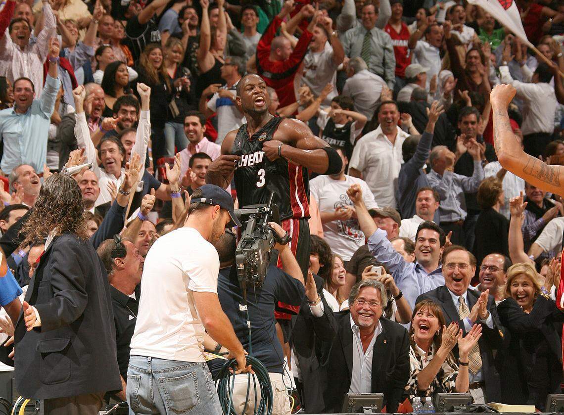Dwyane Wade #3 of the Miami Heat celebrates a victory over the Chicago Bulls on March 9, 2009 at the American Airlines Arena in Miami, Florida. This moment was the inspiration behind the statue of Wade in front of the Kaseya Center in downtown Miami.
