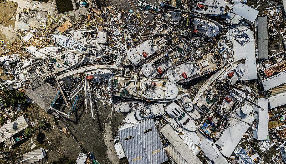 A day after Hurricane Ian hit Florida’s west coast as a Category 4 storm, wrecked boats and a shrimping fleets can be seen at San Carlos Island.