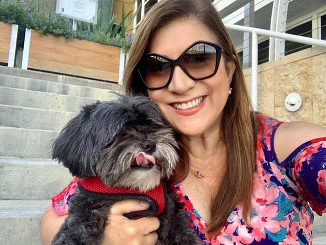 Brickell Key resident Viviana Santiesteban and her Shih Tzu, Benjie. Both were sickened when disinfectant was sprayed around the island.
