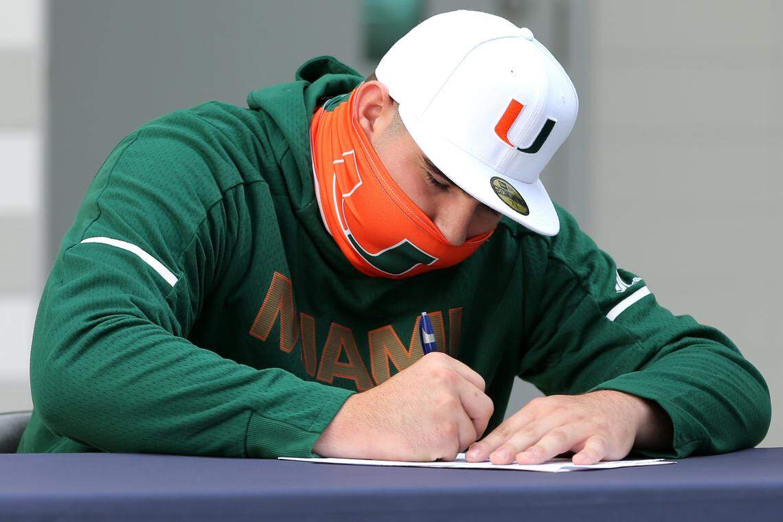 Ryan Rodriguez signs a National Letter of Intent committing to join the University of Miami football program during a ceremony at Christopher Columbus High School on Early National Signing Day in Miami, Florida, Wednesday, December 16, 2020. 