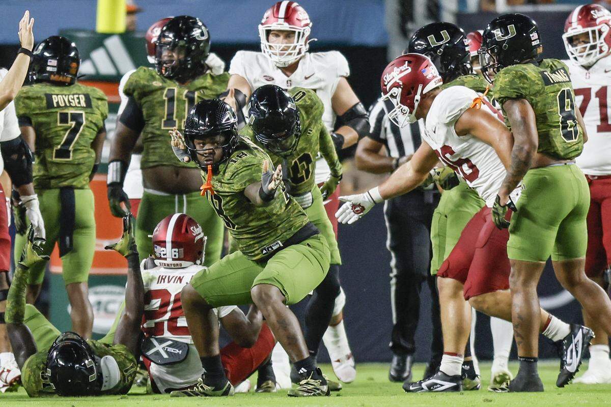Miami Hurricanes defensive lineman Armondo Blount (18) reacts after tackling Stanford Cardinal running back Sedrick Irvin (26) during the first half of their NCAA football game at Hard Rock Stadium in Miami Gardens, Florida, on Saturday, October 25, 2025.