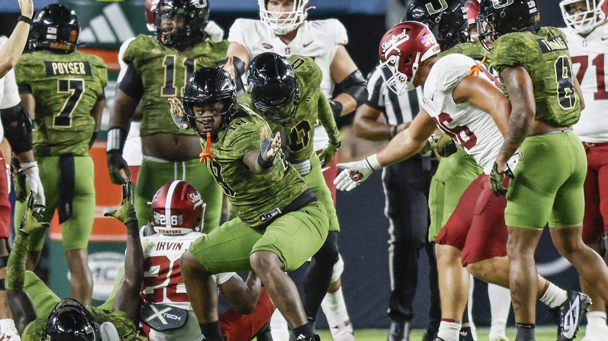Miami Hurricanes defensive lineman Armondo Blount (18) reacts after tackling Stanford Cardinal running back Sedrick Irvin (26) during the first half of their NCAA football game at Hard Rock Stadium in Miami Gardens, Florida, on Saturday, October 25, 2025.
