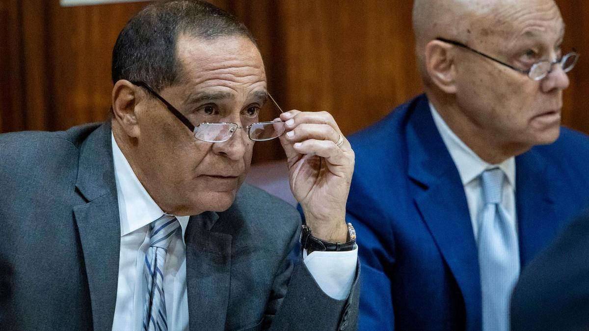 Miami, Florida, Oct. 30, 2024 - Suspended Miami-Dade Commissioner Joe Martinez, left, sits in Judge Miguel de la O’s courtroom along with his attorney, Neil Taylor, during his trial for public corruption at the Miami-Dade County Criminal Courthouse.