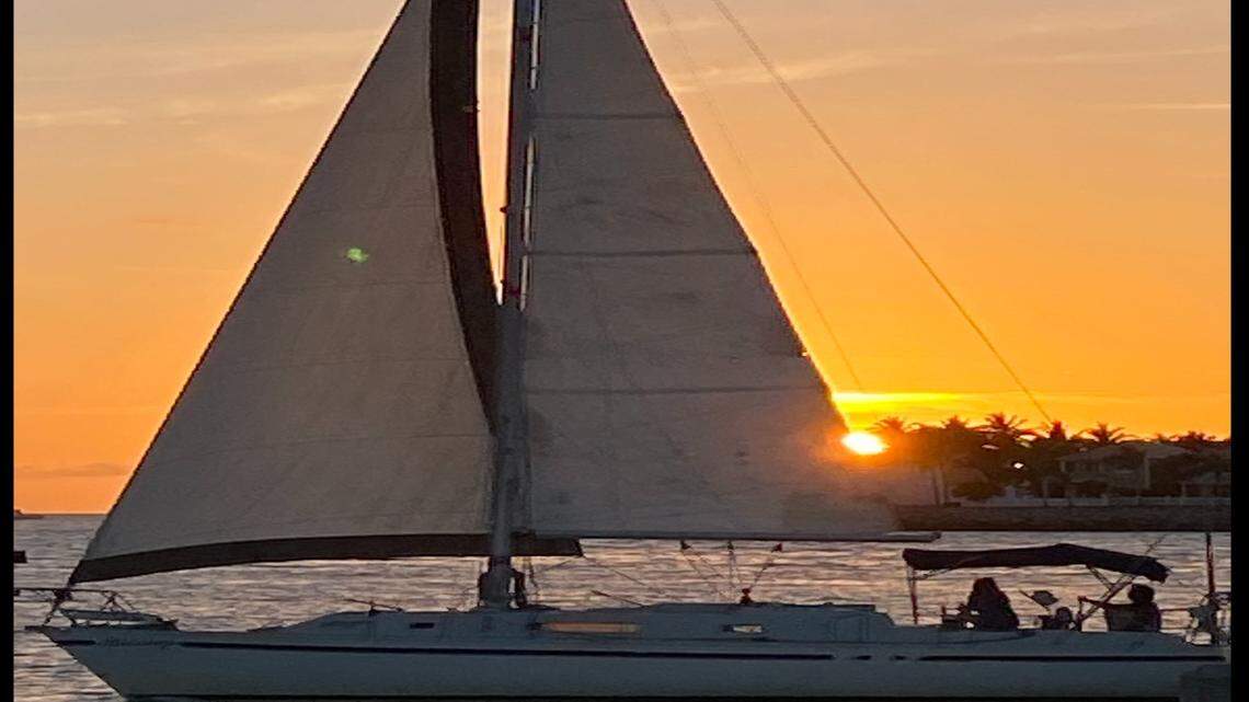 A sailboat passes by Malory Square at sunset Wednesday, March 31, 2021.
