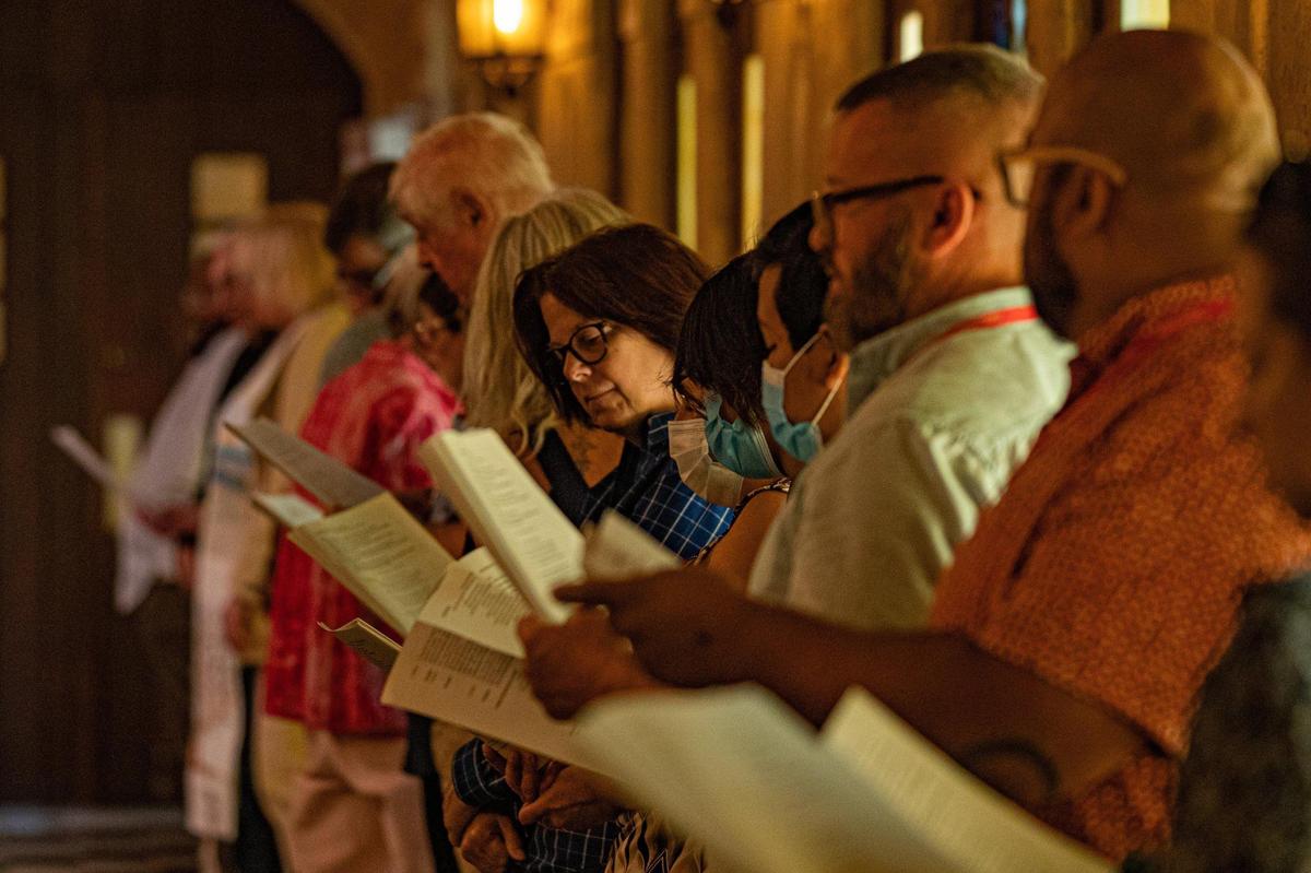 People sing “How Beautiful, Our Spacious Skies” during “An Interfaith Service of Remembrance, Hope, and Peace” on the 21st anniversary of 9/11 at Coral Gables Congregational United Church of Christ in Coral Gables, Fla. on Sept. 11, 2022.