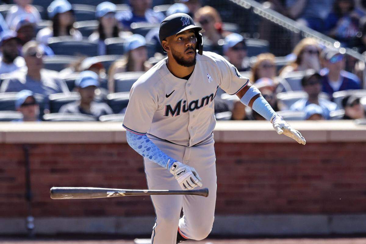 Miami Marlins’ Jerar Encarnacion drops his bat after hitting a grand slam against New York Mets relief pitcher Seth Lugo during the seventh inning of a baseball game, Sunday, June 19, 2022, in New York.