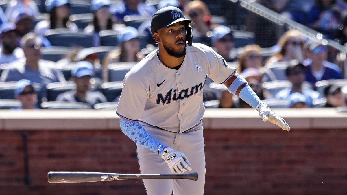 Miami Marlins’ Jerar Encarnacion drops his bat after hitting a grand slam against New York Mets relief pitcher Seth Lugo during the seventh inning of a baseball game, Sunday, June 19, 2022, in New York.