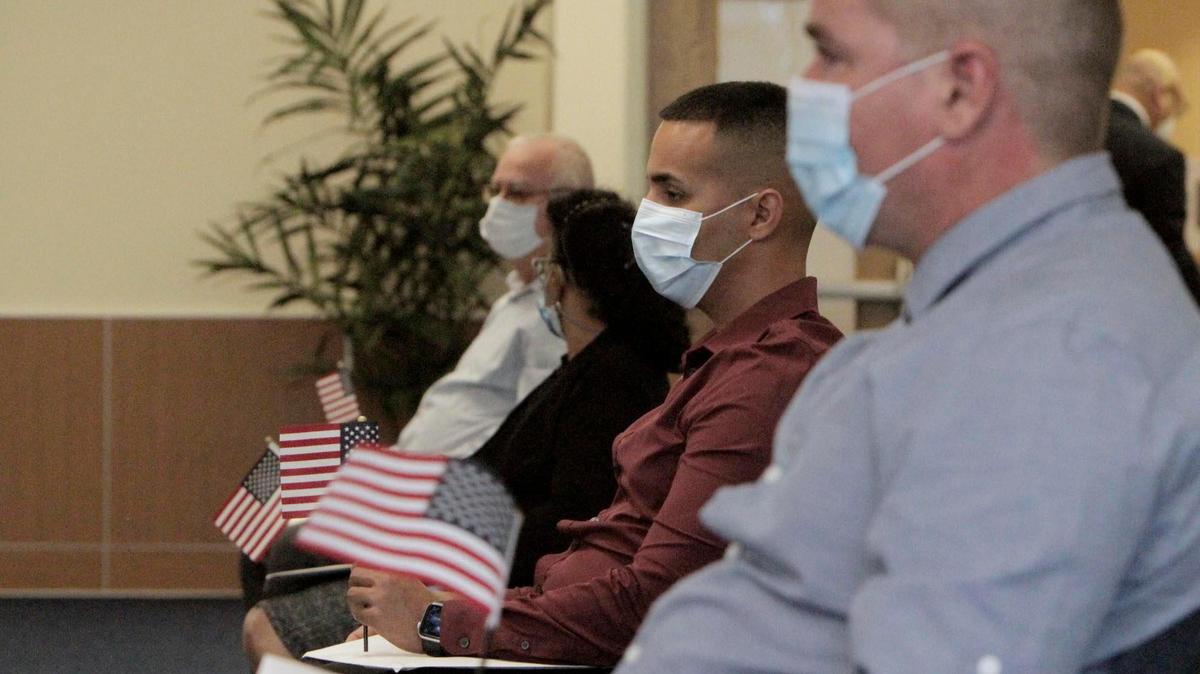 Miami, Florida, June 4, 2020- New American Citizens wait to be called to get their certificate at a USCIS facility in West Kendall. The new ceremonies are shorter to limit exposure to those in attendance and only 10 people at a time are sworn in. Under the shortened format, all legally required portions of the ceremony will take place. Attendance is limited to the candidates who are scheduled to be naturalized, a parent or trusted adult if the candidate is a minor and individuals providing disability assistance to a candidate.