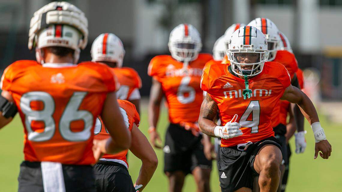 Miami Hurricanes running back Jaylan Knighton (4) runs drills with his team at the University of Miami’s Greentree Practice Fields on Monday, Aug. 8, 2022, in Coral Gables, Fla.
