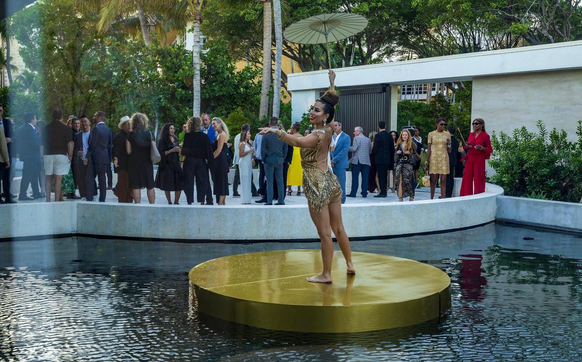 A dancer is center stage at the Mandarin Residences sales center during a grand closing gala on Thursday May 15, 2025.