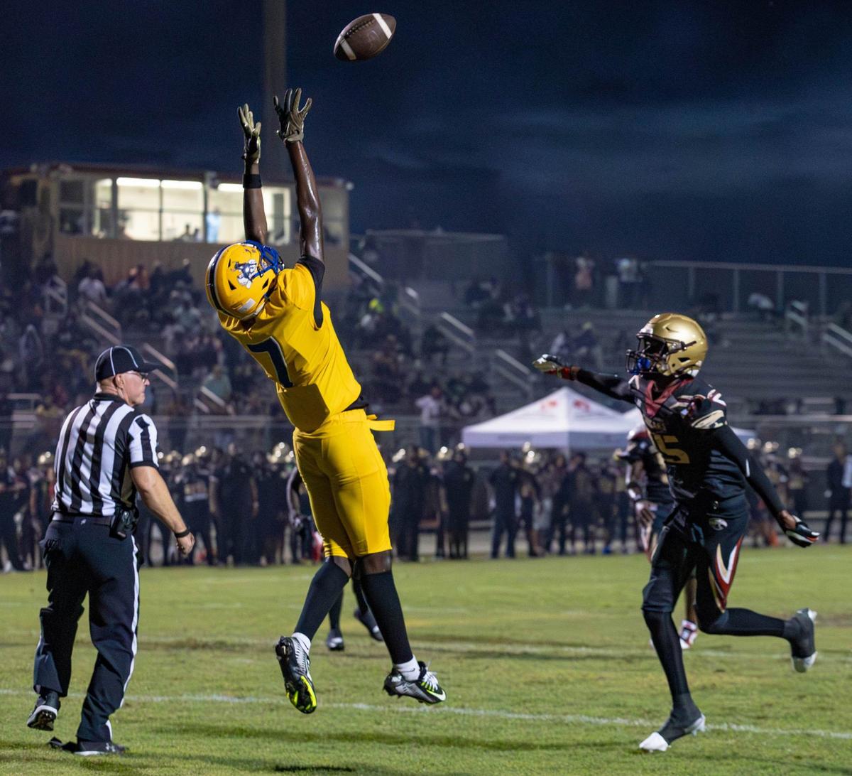 Miami Northwestern Bulls wide receiver Nicsaint Joseph Jr. (7) catches a touchdown pass in the first half of their football game against the Coconut Creek Cougar at Coconut Creek High School on Thursday, Aug. 22, 2024, in Coconut Creek, Fla.