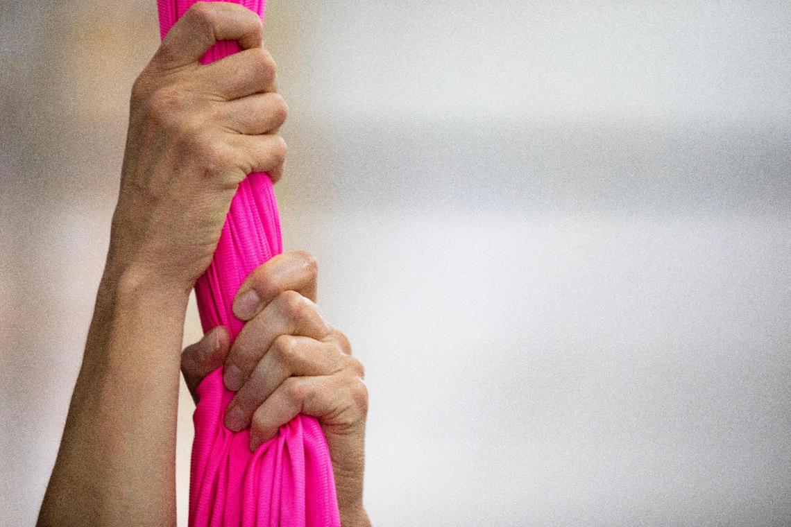 Mila Puletti grips the silks while training at the Miami Circus Arts Center on Aug. 18, 2023, in Miami, Fla. Puletti said silks are her most challenging but favorite apparatus. She tried the apparatus for the first time at a class in Doral in 2018. “I fell in love with it right away,” Puletti said. “I mean, the challenge; it’s the adrenaline; it’s – I don’t know – I just love it. It’s the feeling that I get while I’m up there.”