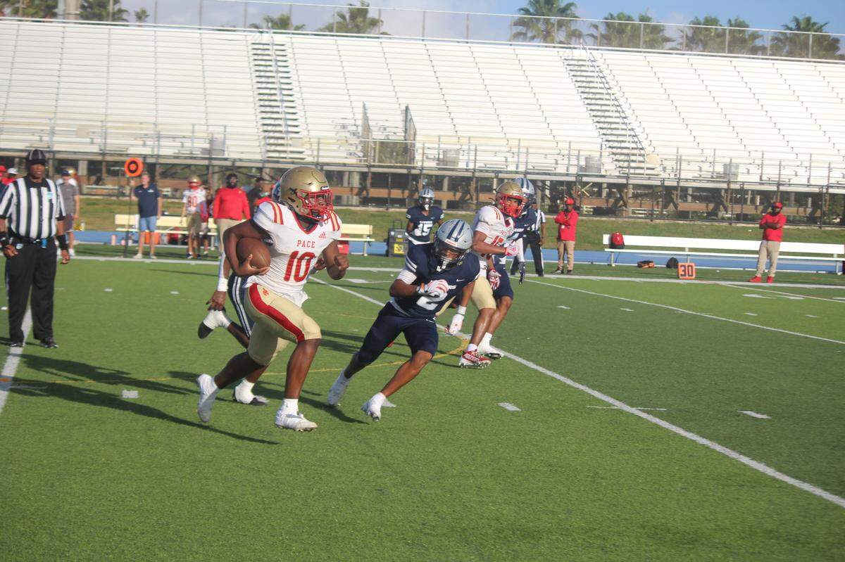 Monsignor Pace quarterback Sean Ponder takes off on a 51-yard first quarter run to the Gulliver two yard line during Friday’s Region 4-2M quarterfinal playoff game. Ponder scored on the next play.