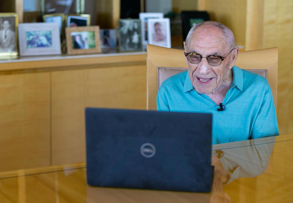 Holocaust survivors Jack Waksal, 97, and Sam Ron (not pictured), 97, talk over a Zoom call at Waksal’s apartment in Bal Harbour, Florida on Tuesday, April 26, 2022. Both men recently reunited at the U.S. Holocaust Memorial Museum’s annual dinner in March in Boca Raton after 79 years. The two were in the same work camp in occupied Poland.