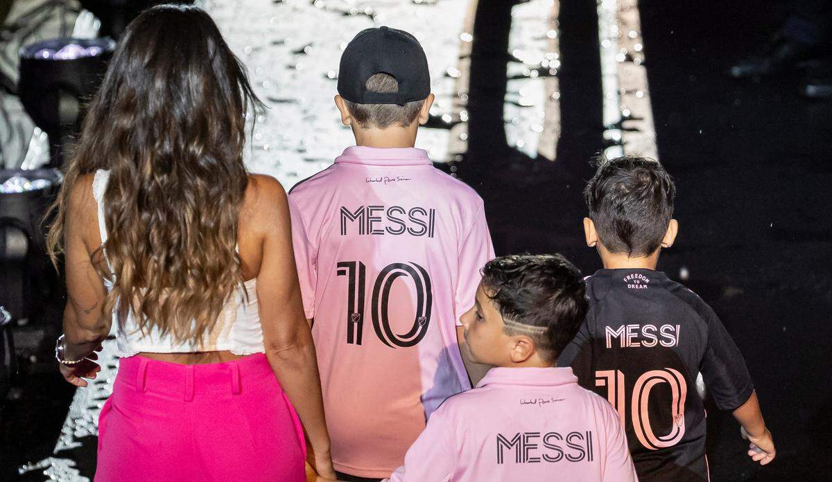 Lionel Messi’s wife, Antonela Roccuzzo, and sons, Thiago, Mateo and Ciro walk on the stage during Inter Miami’s The Unveil event at DRV PNK Stadium on Sunday, July 16, 2023, in Fort Lauderdale, Fla. The event was held to officially welcome Argentine forward Lionel Messi (10) and Spanish midfielder Sergio Busquets (5) to the team.