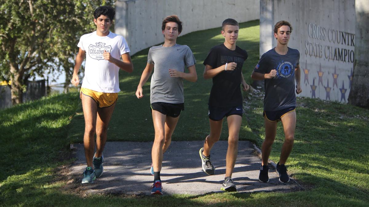 Belen Jesuit cross country runners, from left to right, Caesar Aguzzi, Sebastian Roa, Adam Magoulas and Lucas La Hoz warm up before practice at Belen Jesuit Thursday afternoon, Sept. 6, 2018.