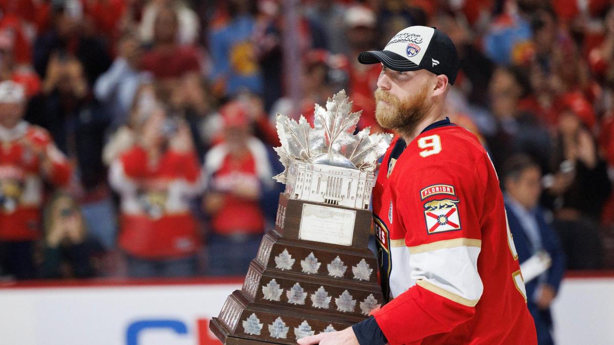 Florida Panthers center Sam Bennett (9) holds the Conn Smythe trophy after the Panthers defeated the Edmonton Oilers in Game 6 winning the NHL Stanley Cup Final at Amerant Bank Arena on Tuesday, June 17, 2025 in Sunrise, Fla.