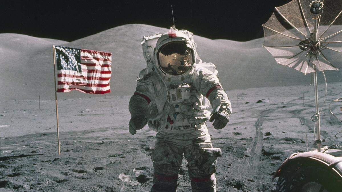 In this Dec. 12, 1972, photo provided by NASA, Apollo 17 commander Eugene Cernan stands on the moon. NASA announced that former astronaut Cernan, the last man to walk on the moon, died Monday, Jan. 16, 2017, surrounded by his family. He was 82. (NASA via AP)