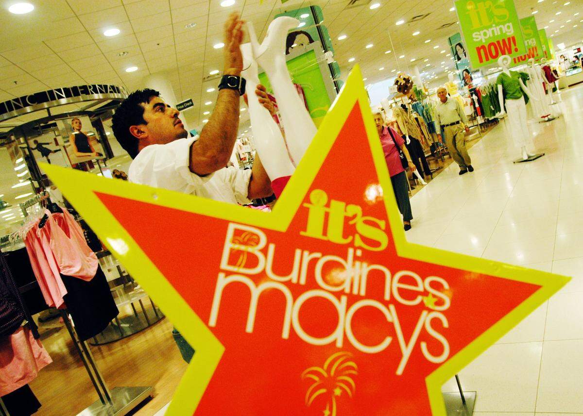 In this file photo from Jan. 22, 2004, Jesur Mier dresses the manequin at the Burdines in Aventura Mall. South Florida’s Burdines and New York’s Macy’s merged that years and all of its stores initially used a hypenated name. It was part of a Federated Department Store strategy to leverage the Macy’s name nationally while still keeping the local flavor of Burdines.