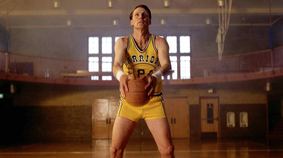 Rick Barry #24 of the Golden State Warriors voted one of the Fifty Greatest Players poses for a portrait shooting his patented underhand foulshot in a gym in 1996.