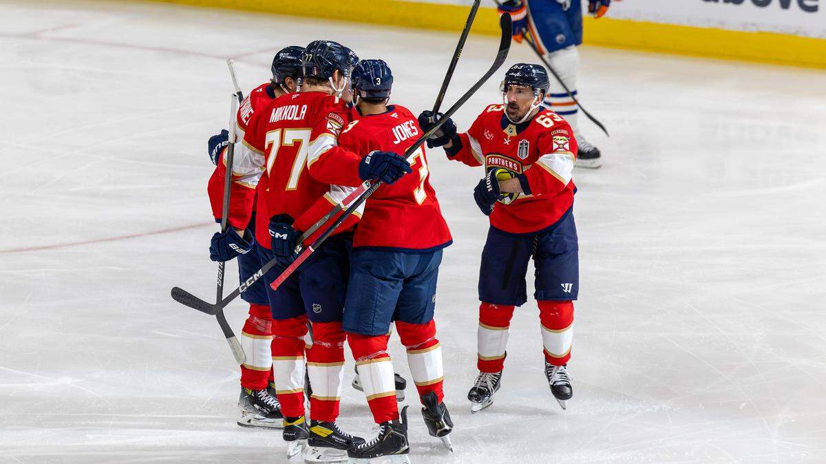 Florida Panthers center Brad Marchand (63) celebrates with teammates after scoring during the first period against the Edmonton Oilers in Game 3 of the NHL Stanley Cup Final at Amerant Bank Arena on Monday, June 9, 2025, in Sunrise, Fla.