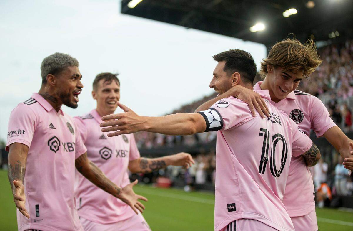 Inter Miami forward Lionel Messi (10) celebrates with Benjamin Cremaschi (30), Josef Martínez (17) and Robert Taylor (16) after scoring a goal against Atlanta United in the first half of their Leagues Cup group stage match at DRV PNK Stadium on Tuesday, July 25, 2023, in Fort Lauderdale, Fla.